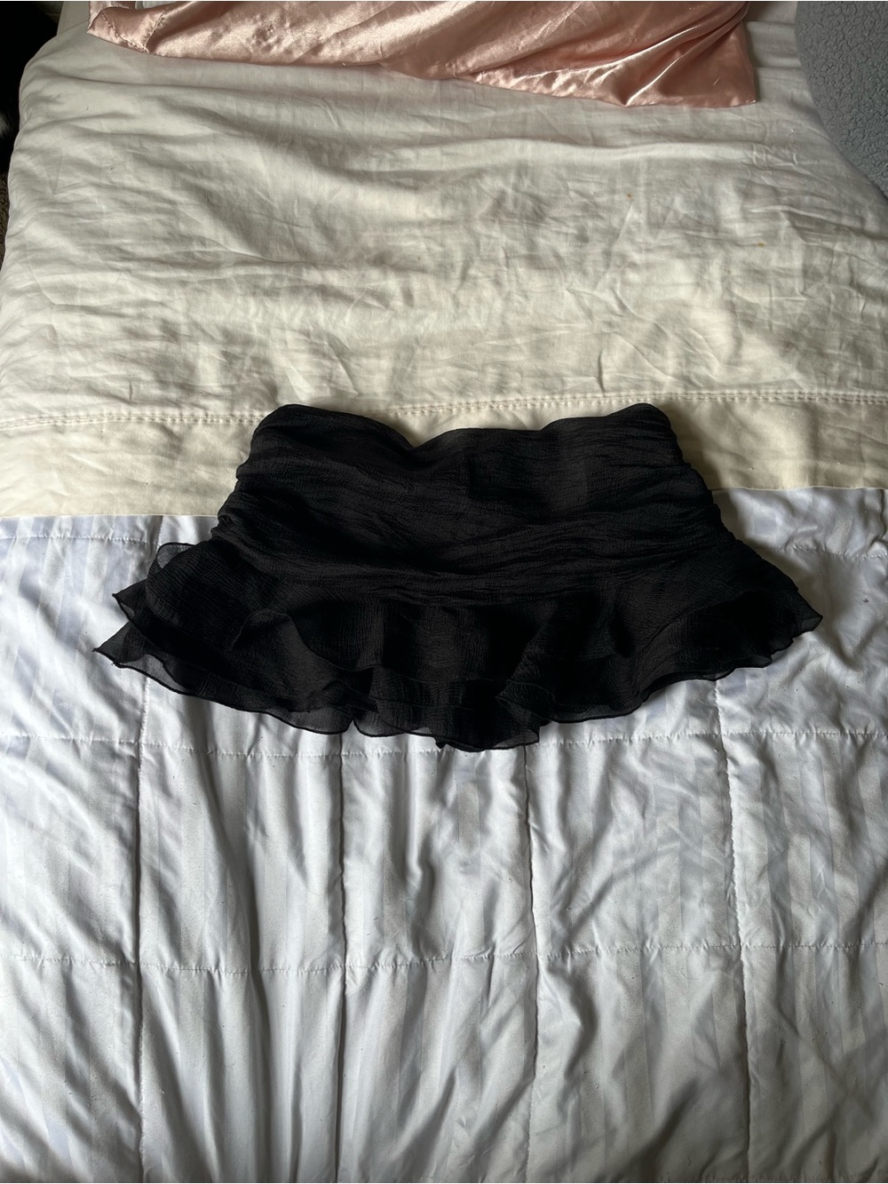 Black ruffled mini skirt
